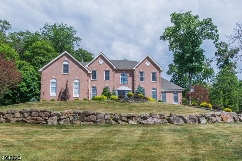 Majestic Colonial set on a premium 1.6 acre gorgeous park like property, Dramatic 2 story entry,  custom moldings, NEW KITCHEN, top of the line S/S appliances, quartz counters and huge center island, Separate breakfast area open to 2 stry Great Room, FPL, Den/office plus Conservatory complete the 1st level. Back staircase leads to the 2nd level, Luxury Master suite includes a sitting room , Huge walk-in custom organized closet ,  Master bath, Jacuzzi, 2 vanities and shower. Princess suite w/ full bath, Additional 2 bedrooms share a new Jack n Jill bath with custom cabinets. there are additional upgrades throughout the home.New windows on 2nd level, new garage doors, numerous hi-hats, plus much more.The new deck overlooks a one of a kind  1.6 acres of private, wooded park like yard.