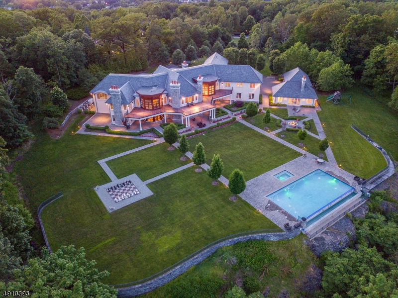 Come live in the most spectacular estate in NJ. Built in 2011, this 5+ acre private estate will take your breath away with its panoramic views of the NYC skyline, from the GW Bridge to the Verrazano bridge! The estate features 8 bedrooms each w/ full bath included. an in-law suite, maid's quarters, one bedroom pool house w/ living room, fireplace, full kitchen & bath. Elevator, Generator, Wine Cellar, Sauna, workout room, media room, life size chess set and so much more! The home is tucked away on private road with just 4 other estates to ensure absolute privacy all year round. Own your dream home!