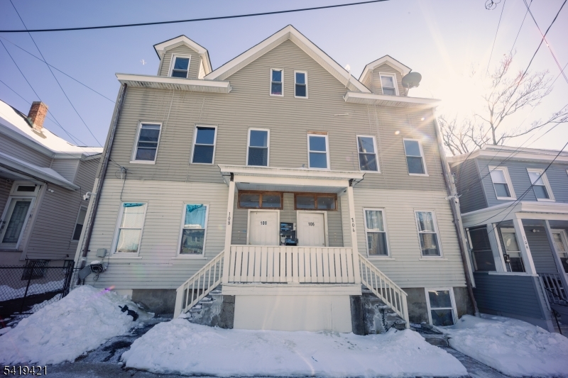 Exceptional High-Yield Multifamily Opportunity Less Than 20 Miles from Times Square. Located in a high-demand commuter corridor in Paterson, NJ, is this robust 6 residential-unit income property. Built for operational efficiency and low vacancy, this two-story building features an ideal, uniform asset mix of six spacious 2-bedroom, 1-bath units.Capital expenditure and risk are heavily mitigated by having three units which have already been recently renovated with modern finishes. Which will command top-of-the market rents and secure premium, long-term tenants. A shared driveway leads to approximately 5 private, off-street parking spaces? a massive tenant draw that minimizes turnover in this dense urban market. Additionally, the property is equipped with an advanced 22-camera security system, delivering unparalleled remote operational oversight, liability protection, and enhanced tenant safety. Whether expanding a portfolio or executing a 1031 exchange, this asset delivers immediate cash flow, ease of management, and long-term equity growth in a resilient, transit-oriented market. Turnkey infrastructure with strong fundamentals?schedule your acquisition tour today.