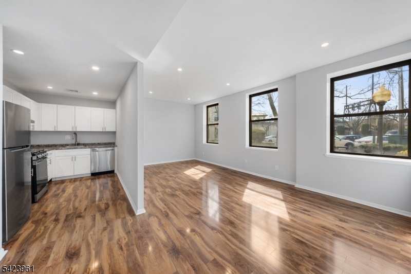 Perfectly positioned in the heart of downtown Rahway, this beautifully renovated one-bedroom condo offers the ultimate convenience?located directly across the street from the train, making it a dream for commuters. This bright and airy unit features high ceilings and an abundance of natural light, creating an open and inviting atmosphere throughout. The updated kitchen flows seamlessly into the living and dining areas, ideal for both everyday living and entertaining. The spacious bedroom, fully renovated bathroom, and in-unit laundry add to the comfort and functionality of the home. One assigned parking space is included for added convenience. Just steps from Rahway?s vibrant downtown, with restaurants, shops, and easy access to major highways, this is an incredible opportunity to own a move-in ready home at a budget-friendly price. Why rent when you can own and start building equity?