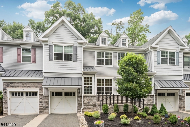 Drop your bags and move right into this pristine, fully renovated townhouse in Farm Estates. Showcasing approximately 2,700 square feet of finished living space across three levels, this exceptional home is appointed with high end finishes throughout. Upon entering, you?re welcomed by gleaming hardwood floors, 9-foot ceilings, and an open concept layout. The beautifully updated eat-in kitchen features custom cabinetry, sleek granite countertops, and newer stainless steel appliances. The living room is anchored by a gas fireplace with a striking floor to ceiling stone accent wall and custom built-ins that add warmth and character. Upstairs, a spacious loft provides the perfect setting for a home office, or additional sitting area, along with a convenient laundry room. Three generously sized bedrooms include the luxurious primary suite, offering two walk-in closets and a spa-inspired bath with an oversized shower, double vanity and soaking tub. The fully finished lower level expands the living space with a large rec room featuring an electric fireplace, a full bathroom, and a versatile bonus room ideal as a potential 4th bedroom. Step outside to your private backyard retreat complete with a paver patio, beautifully landscaped grounds, and an 8-foot privacy fence?creating the perfect setting for relaxing or entertaining. Ideally situated just moments from NYC transportation and top-rated schools, this turnkey home delivers the perfect blend of luxury and convenience!