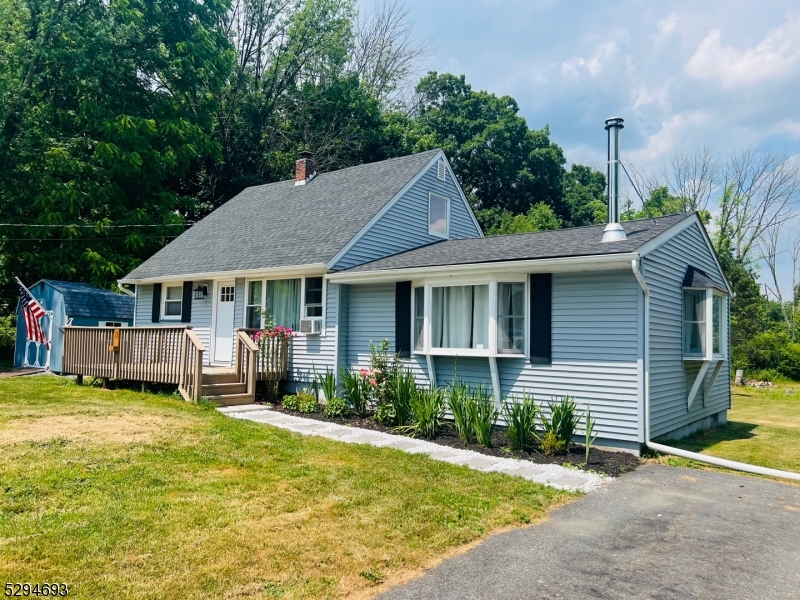 Charming cape home on private dead end street with just over 1/2 acre! Features 3 bed & 2 full baths. This home was completely renovated 2017. Updated septic, roof, gutters, and furnace. Paved driveway. Original hardwood floors have been refinished on 1st floor. Primary bedroom with en suite bath on 1st floor. Large and bright great room with french doors lead to the deck and back yard. Full unfinished basement for lots of storage. Lower taxes, convenient to Rt 94 & Rt 23 for easy commuting! Not in a lake community. Newer appliances in kitchen. This is a must see!