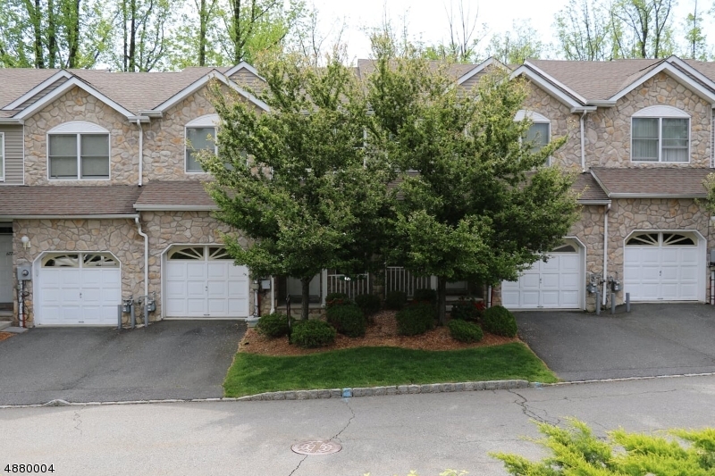 NOW AVAILABLE!  TULIP MODEL!  Hardwood Floors on first level, double story entrance.  Open Kitchen floor plan with a deck looking out to wooded lot.  Second floor bedrooms each with their own full bathroom.  Walk-in closet in Master Bedroom.  Full basement with a walk-out featuring sliding glass doors to the backyard.  Morris Plains and Denville train station a short drive away.