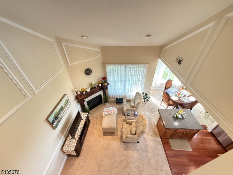 LIVE THE GRANDE LIFE! Best Location! Near clubhouse & pool. 1553 S.F elegance. Beautiful "Hickory Model" 4th flr 2 bedroom, 2 bath condo w/Loft. Cathedral ceiling! Private, quiet end unit. Peaceful views from all rooms. Featuring 2 bedrooms w/WIC in each bdrm. Two full baths! Kitchen w/ ctr island, granite, SS appliances, upgraded cabinets. Spacious LR w/gas FP. Separate dining area with plenty of windows and light. Spacious Loft which can be used as another bedroom, office or whatever your heart desires. Laundry rm accommodates full size W/D side by side! You will fall in love with this beauty! Amazing low Riverdale taxes only $8,058.  Water heater only 2 years old.  A/C only 4 years old. One car garage assigned parking space underneath bldg. Plus add'l parking. Experience the Grande life with a wealth of amenities, including 2 clubhouses equipped with fitness centers, billiards rooms, conference rooms, party rooms, tennis and basketball courts, 2 swimming pools, and much more! Enjoy a fantastic location with easy access to major highways, shopping and restaurants. PET POLICY- MAX 2 PETS-35LB WEIGHT LIMIT PER PET.