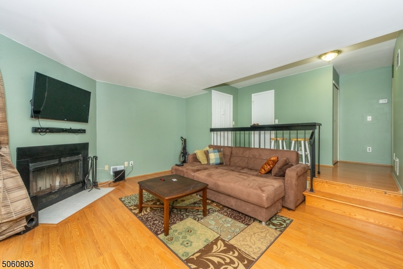 Very affordable 1 bedroom 1 bath unit in Spruce Hills with garage! Unit is complete with laminate flooring throughout, central air, wood burning fireplace, walk in closet and balcony off master, W/D in-unit, natural gas & more! Enjoy a separate dining area with sliding doors leading to a patio & private backyard. Newer furnace/AC/water heater! Community amenities include pool, tennis and basketball court.