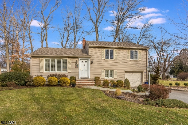 Peaceful, warm and inviting home in the highly desirable Whippany section of Hanover Township!  Hardwood floors & attention to detail throughout this lovely home featuring 3 beds with  2 baths. Gorgeous Kitchen w/custom cherry cabinetry, Wolf stove & Jenn Air Refrig. Great Room with fireplace, high ceilings, recessed lighting & 12ft Anderson Sliders. Ground level features FR, full bath with jetted tub & shower. Basement w/rec room & plenty of storage. Tree lined & wonderfully landscaped yard for entertaining with patio area & level yard for outdoor play. Township has a town pool, community center, before/after school & more. Situated in a great neighborhood with low property taxes & excellent schools. Convenient location with easy access to major highways & Convent train station with Mid-Town direct.