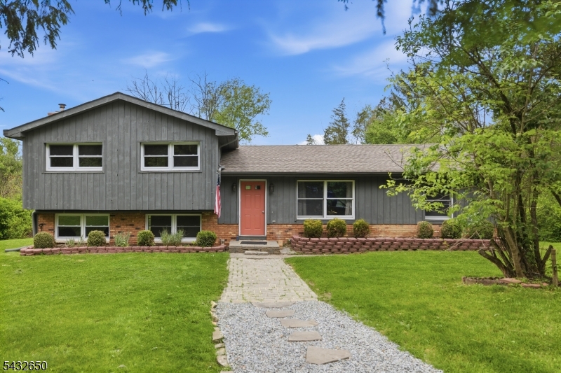 Tucked away on a private road beside the scenic strawberry farm, this spacious split-level home offers privacy, charm, and convenience. Featuring hardwood floors throughout, solid wood interior doors, many newer windows, and a light-filled open floor plan perfect for both everyday living and entertaining. The updated kitchen includes quartz countertops and stainless steel appliances. New roof and septic system installed in 2019. Enjoy peaceful surroundings with easy access to Route 80 and just 10 minutes to Newton for shopping and dining.