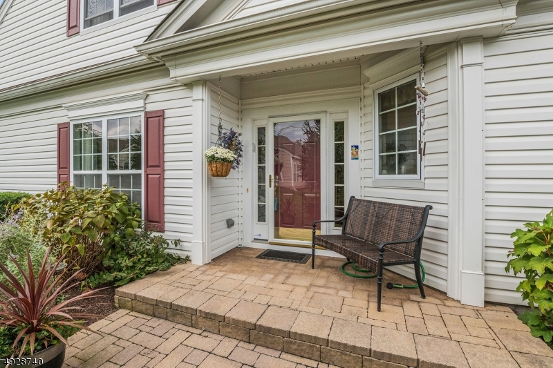 Northeast facing ASTOR w/LOFT, SUN ROOM, UPGRADED KITCHEN/BATHS & PAVER WALK/PATIO!!  Quiet location with common area to left creating an open feeling.  One of the original SPEC homes in the community used as a model by the developer.  Lots of upgrades: Hardwood floors, a kitchen filled w/ cherry cabinets, Corian counter top, SS appliances & a custom table with wine rack!  Upgraded vanities in first floor baths. ADT security hardware. Wonderful exterior with lush plantings, paver walks, patio & porch!  Somerset Run is an Active & Inclusive Over 55 Community with Management & Resident Run activities.  The 25,000 s.f. Clubhouse is always busy and rarely over-crowded!  Summer Olympics, Halloween Party for grandchildren, pickleball, buses to Broadway Shows and more! Minutes to major highways; buses/trains to NYC!