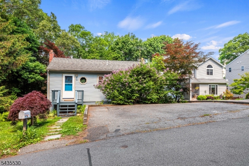 Welcome home to this charming 2-bedroom, 1-bath home located in the heart of Landing, just minutes from beautiful Lake Hopatcong! Optional lake memberships are available, giving you access to all the fun lake living has to offer. This home features parking for 3-4 cars and a private back patio, perfect for relaxing or entertaining. Inside, you'll find a comfortable living room, two bedrooms, and a full main bath. The lower level offers a spacious galley kitchen with ample counter space, breakfast bar and a Bosch dishwasher. Large dining room that could also serve as a family room, and a generously sized utility/laundry room complete with washer and dryer. Enjoy low taxes, public utilities, and a convenient location close to major transportation, shopping, and fine dining. Lake Hopatcong offers boating, fishing, swimming, dining, and year-round recreation. Come enjoy the lake lifestyle and make this home yours today!