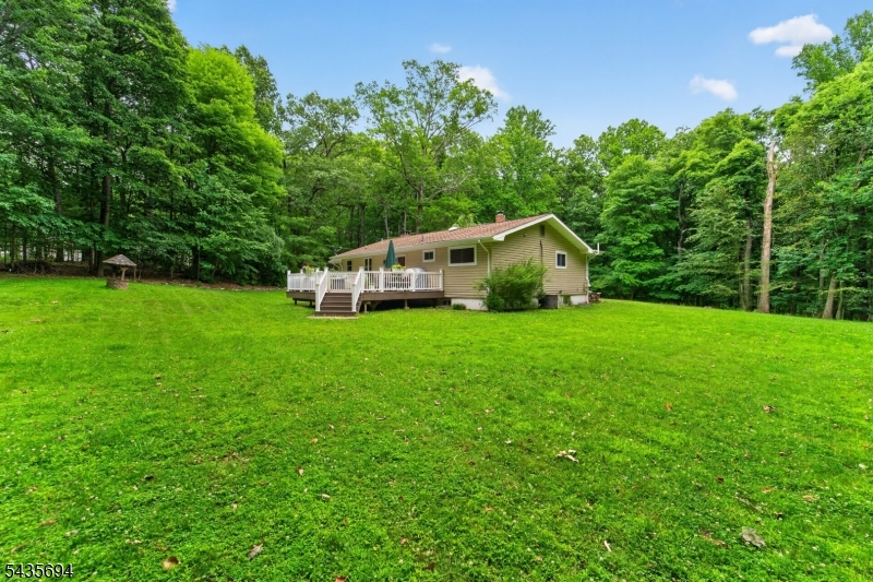 Nestled on over 5 pristine acres, this beautifully updated 3-bedroom, 2.5-bath ranch offers the perfect blend of privacy, comfort, and convenience. Step inside to discover a warm and inviting floor plan featuring spacious living areas, tasteful updates, and a stunning stone fireplace that serves as the centerpiece of the home. The well-appointed kitchen and adjoining living spaces are ideal for both everyday living and entertaining. A finished basement provides additional flexible space for a family room, home office, fitness area, or recreation room. Enjoy peaceful mornings and relaxing evenings on the expansive deck overlooking the picturesque property. The sprawling acreage offers endless opportunities for outdoor enjoyment, gardening, or simply taking in the natural beauty of the surroundings. Conveniently located near top-rated schools, parks, shopping, and the charming river towns, this exceptional property combines country living with easy access to modern amenities. A rare opportunity to own a move-in ready home on a spectacular piece of land. 3 Bedrooms   2.5 Bathrooms   Finished Basement   Stone Fireplace   Expansive Deck   5+ Acres A perfect retreat for those seeking space, serenity, and a convenient lifestyle.