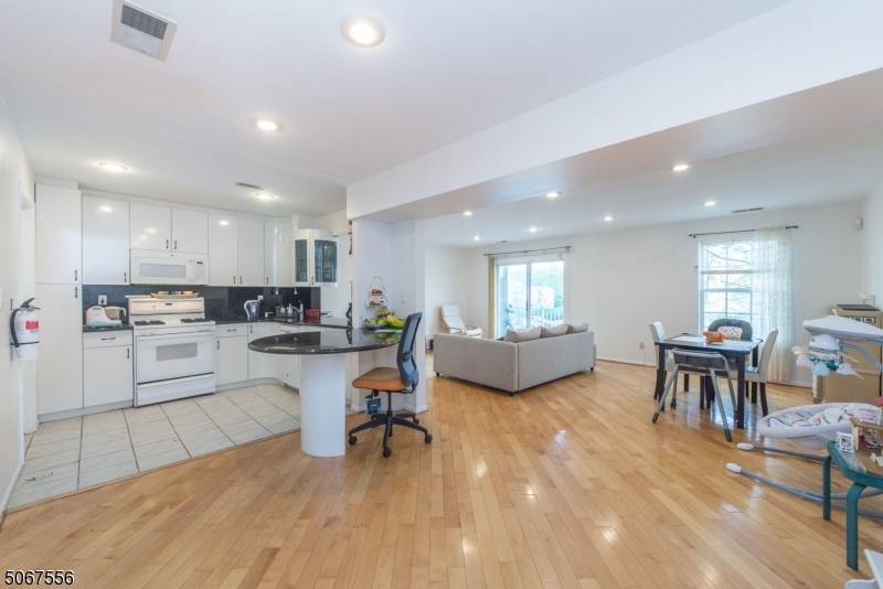 Totally open concept granite countertop breakfast bar totally updated Enjoy the pool wood floors recessed lighting 2 decks great location to Morristown & NY City Master has walk in closet sitting area Living room has a deck Newer carpeting in bedrooms 2nd bedroom has a deck great spot to relax