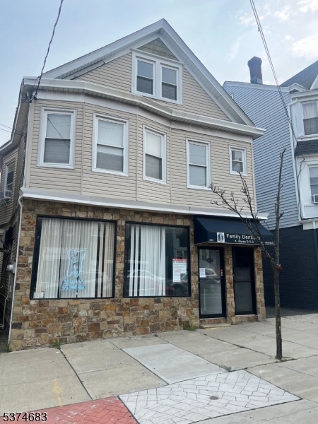Don't miss this well-maintained mixed-use property featuring an approximately 1,300 / 1,400 sq ft commercial space on the first floor, currently operating as a dental office, featuring three built-out rooms, lab, storage rooms, 1 full bath and 2 half baths, and central air throughout. The unit will be delivered vacant ready for your own business or a new tenant. Upstairs you'll find a spacious 3-bedroom, 1-bath residential unit, ideal for rental income or owner occupancy. The property also offers a full walk-up attic with potential for expansion, a walkout basement, and private parking for up to 4 vehicles. Located in the heart of Prospect Park Borough , the property is a short walk from local shops, eateries, and transportation. An excellent investment or live/work opportunity with flexible use potential .
