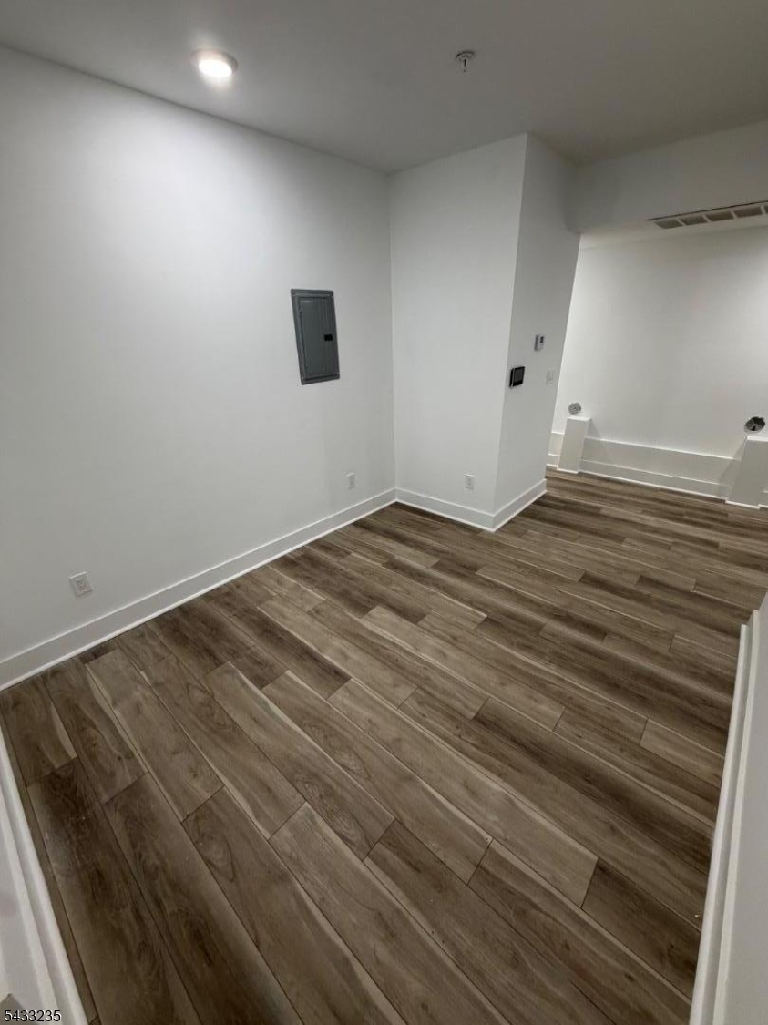 Beautiful new construction ground-floor 2-bedroom, 1-bath apartment offering modern finishes and everyday convenience. This cozy unit features central heating and cooling, an in-unit washer and dryer, and a video intercom system for added comfort and security. Enjoy access to a shared rooftop space perfect for relaxing or entertaining. Conveniently located near transportation, shopping, dining, and everyday essentials, making commuting and city living simple and accessible.