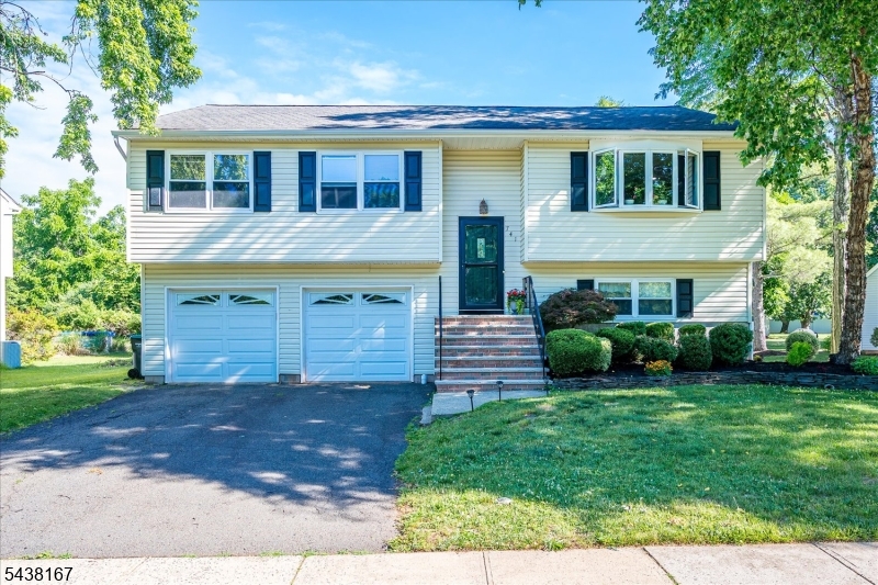 Located in the desirable Sunrise section of Hillsborough, this move-in ready 4-bedroom, 2 full bath bi-level offers space, comfort, and updates throughout. The upper level features a spacious living room and dining room with sliding glass doors leading to a low-maintenance Trex-style composite deck overlooking a scenic trail. The kitchen boasts stainless steel appliances, granite countertops, a breakfast bar, and recessed lighting. Laminate flooring and fresh neutral paint flow throughout the home, while the updated main bath offers dual access from the primary bedroom. The lower level includes a fourth bedroom, a second full bath, and sliding glass doors leading to a paver patio, providing flexible living space ideal for guests, a home office, or recreation. Additional highlights include a large laundry room with washer and dryer included, plus a furnace and central air system replaced in 2020. Conveniently located near parks, shopping, and major commuter routes, this well-maintained home is ready for its next owner.