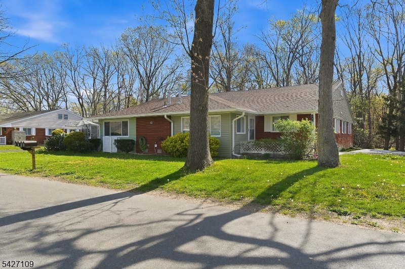 Welcome to easy, low-maintenance living in a desirable 55+ community known for its quiet atmosphere and welcoming social environment. This beautifully updated 2-bedroom quad style home is move-in ready, featuring a new kitchen and bathroom. You'll also find a convenient utility room with laundry hookups, and attic space. The outside living space offers a private patio, ideal for morning coffee or relaxing evenings, and backs to a wooded area. The home also includes a paved driveway for off-street parking. Ideally located, you will have easy access to local restaurants, shopping centers, beaches, and transportation.