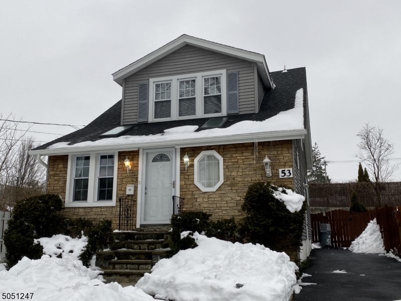 MUST SEE! Great starter home, Cozy&Charming, stone decor in front, LR w/ fireplace, EIK, hwdwd flrs,part-finished bsmnt w/ storage rm/den, beautiful bckyd w/ deck, Easy access to NY, Rt 80/46/287/10 Sunny and bright throughout w/ skylights, Laundry room and plenty of storage in basement, Minutes to downtown, dining, shops and buses. No Flood Insurance Required.