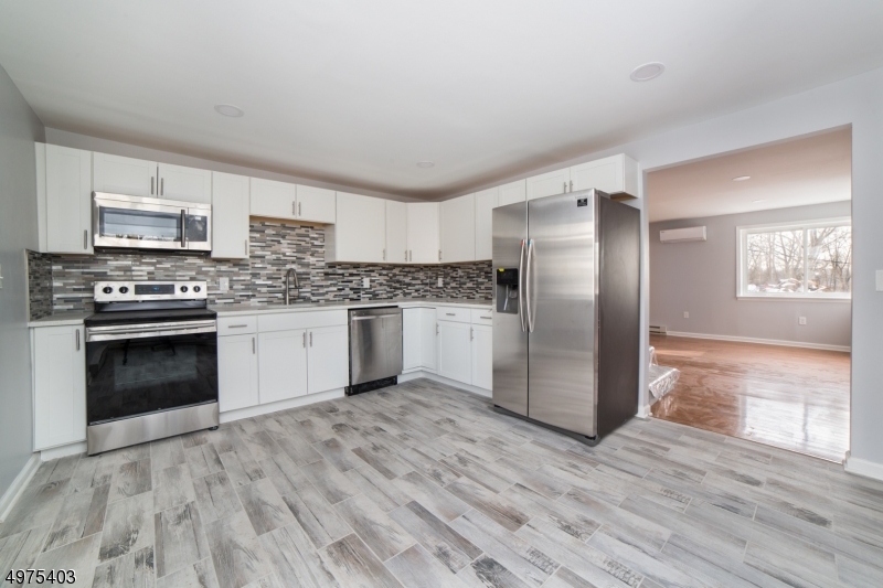Fully Renovated 3 Bedroom, 2 Full Bath with bonus 1st floor office or extra bedroom in East Shore Section of Lake Hopatcong. Home Features brand new Roof, Siding, Electric, Plumbing, high efficiency ductless A.C. units, hardwood flooring, quartz counter-tops. Huge master bedroom with sliders that walk out to your own private deck.