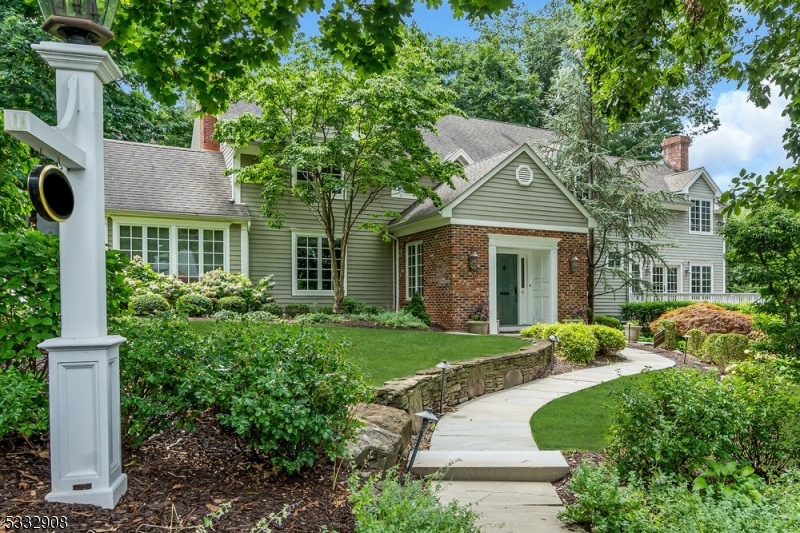 NEW listing: This Grand Sized Chandler Road home features an open floorplan, walls of windows, and a direct connection to the outdoors with multiple decks and patio. Perfectly located just steps away from schools, town & train, this home offers expansive grounds, stone walls, meticulous landscaping & an open floor plan that seamlessly connects living spaces. A tiled Foyer with two Closets steps up into the Front Hall flanked by a Formal Living Room and Formal Dining Room with access to one of four Outdoor Decks. The Sunroom with vaulted ceilings shares a Double Sided FP with the Living Room & is great location for a Home Office & overlooks a side yard accessible via sliding doors to patio.The gourmet Kitchen is equipped with a double Sub Zero refrigerator with four freezer drawers, six burner Wolf range with double full sized ovens, double dishwashers and a walk-in Pantry. Entertaining is a breeze in this home! The family Room has a massive Stone wood burning Fireplace & access to front & rear Decks. The second floor offers 5 second floor Bedrooms all featuring wood floors and soaring high ceilings, and including a Primary Suite with two WIC's, private balcony, bathroom with a large soaking tub, double sink vanity & an alcove style shower.The Lower Level features large Rec Room, Movie Room, Gym and full Bath. Large 2 car garage is complete with Tesla Charger. Bonus features: Generator, Radiant Heat, Lawn Sprinkler System and so much more!