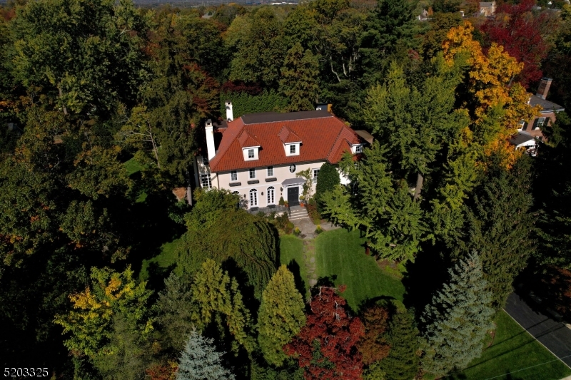 Breathtaking custom colonial built by Dixon Peer nestled on .75 acres.  This sun-soaked gem features gleaming hardwood floors, abundant windows and an expansive open floor plan  Formal reception rooms and an oversized office/library with fireplace, gives way to the heart of the home with a spacious kitchen, and fireside family room.  Open view to picturesque gardens with a bluestone patio, spacious salt waater heated pool and new outdoor pergola and kitchen  Only .8 miles to town.