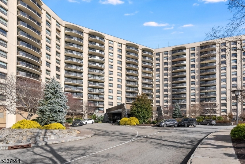 Don't wait to view this immaculate and impeccably maintained two-bedroom, two-bathroom residence in the prestigious Claridge House community. Set in a serene location atop First Mountain, this east-facing unit offers peaceful views from its private balcony and features a generously sized primary bedroom with two walk-in closets, parquet floors, and high ceilings. The galley kitchen is functional and presents an excellent opportunity for modernization to suit your personal style, while the in-unit washer and dryer and second full bathroom add everyday convenience. Residents enjoy an array of upscale amenities, including a heated swimming pool, modern fitness center, tennis and pickleball courts, a library, putting green, party rooms, and a same-floor storage locker. The building's 24/7 concierge service and valet parking ensure a seamless living experience, and its ideal location provides easy access to public transportation, major highways, shopping, dining, and recreational facilities offering the perfect blend of luxury and convenience.