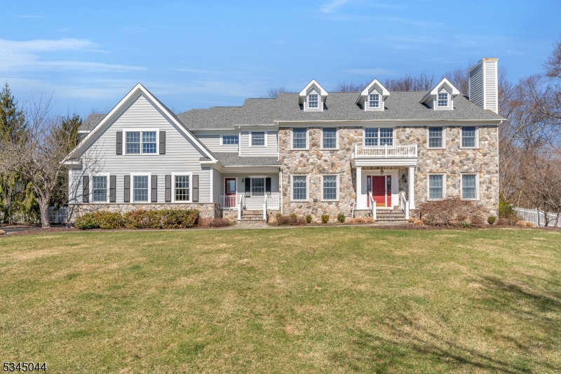 Welcome home to a classic 5 Bedroom, 4.5 Bath center hall Colonial that has been beautifully maintained and upgraded by the original owners over the last 27 years. A large two-story foyer greets you as you enter this spacious home. The formal living room has a fireplace and French doors to a formal office. The formal dining room w/tray ceiling also opens to the gourmet kitchen. A step-down two-story family room with another charming fireplace and a wall of windows overlooks the private, fenced rear yard. The chef's kitchen features a large center island, custom decorative artistic tiling and a separate breakfast room with more walls of windows and sliders leading to a new Trex composite all weather deck. Also on the main level is a large laundry room, powder room, side entry, study with bow windows, screen porch, and a three-car garage w/ direct access to the 2nd basement stairs. On the second level you will find a large master suite with 2 walk-in closets and a sumptuous master bath with soaking tub and walk-in shower.  There are 4 additional bedrooms and 2 more full bathrooms.  In the finished basement you will find wainscoting, another full bath, a recreation room, an exercise room, a cedar closet, a wine closet, and a large storage/utility room with tons of shelves. Other features include 2 zone heating (1st floor new/1 year HVAC), alarm system, gutter shields, sliding screens on all doors, fully fenced rear yard, whole house generator, sprinklers, and a backyard gazebo.