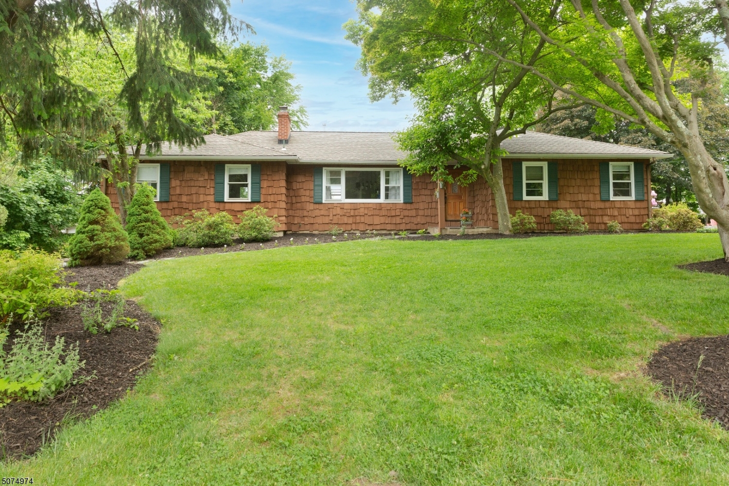 Set on a serene, freshly landscaped, generous size piece of property, this newly updated open concept living ranch is nestled in a fabulous, attractive neighborhood. Super quiet location with so much to offer; mins from Hedden County Park, close to major hwy, YMCA, playgrounds galore. Tons of natural sunlight with recent renovations to create a modern open floor plan. Refinished HDWD flrs, plus add;l new flooring added in the Kitchen and Living Rm. Two wood burning FP w/slate hearth. This home offers views that can be seen from the inside of the screened porch of mountains in the distance. The screened porch leads to a deck overlooking a spacious private yard. Each bedroom has something to offer with a full bath in the MB. 2 car garage and huge full basement! The location and this home could not be better!