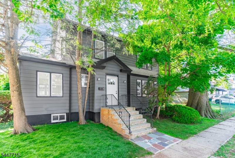 Classic Elizabeth charm meets modern comfort in this beautifully renovated 3-bedroom, 2.5-bath home, set on a deep 45 x 120 lot! Central air conditioning keeps things comfortable year-round, while recessed lighting throughout adds a clean, updated touch to the home's timeless character. 6 rooms across two levels, plus walk-up attic potential and a fully finished basement with laundry and abundant storage, offer flexibility to grow into the space. Charming details await at every turn: a white brick fireplace with classic mantel, arched doorways, a formal dining room with elegant stained glass pendant lighting, a cozy den, and rich hardwood floors, all leading out to a classic slate front walkway. A detached 1-car garage plus driveway parking make coming home easy. Ideally located on a wonderful tree-lined street close to schools, parks, shopping, and NYC transportation   this one has it all.