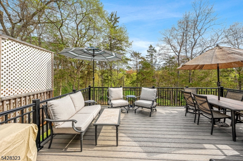 Set within an established Branchburg community, this home blends thoughtful upgrades with a setting that feels calm and connected. The main level opens into a bright, airy living and dining space featuring soaring vaulted ceilings, skylights, wood burning fireplace and custom built-in bookshelves and cabinetry. Updated flooring and clean, neutral finishes create a move-in ready feel, while dual sliding doors lead to a brand-new deck overlooking a peaceful brook.The kitchen is both functional and refined, offering quartz countertops, a deep sink with integrated glass washer, and a new stainless steel refrigerator. Upgraded lighting with adjustable mood settings enhances the overall ambiance.The upper level includes a primary suite with an ensuite bath, along with an additional bedroom featuring a charming nook, ideal for reading, working, or quiet retreat space. A third bedroom is conveniently located on the ground level, offering flexibility for guests, workspace, or additional living needs.The finished walkout basement expands the living space with versatility and unbelievable storage throughout.Recent upgrades include a new roof, updated windows and sliding doors, upgraded HVAC system, hot water heater, LVP flooring, and new carpeting. Conveniently located near Routes 22, 202, and 78, with access to shopping, dining, and parks.