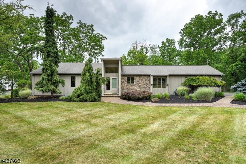Sprawling ranch set on a picturesque property in desirable Readington Township featuring large rooms, a flexible layout, and endless potential. The main level offers 3 bedrooms, while the fully finished basement includes a huge family room, full kitchen, full bath, additional bedroom, and separate entrance ideal for extended living or guest space while still boasting a large rec room. This home also features a deck, patio, whole house generator, and beautifully maintained landscaping. This home was kept with exceptional quality and care, offering a solid foundation and incredible footprint for customization. This home is a must see!