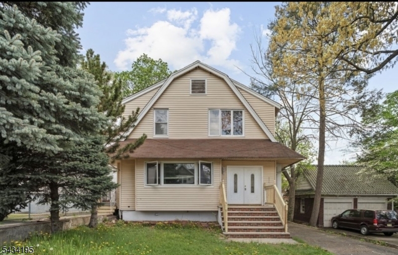 Spacious and well-maintained 4-bedroom, 3-bath home featuring beautiful hardwood floors throughout, a cozy fireplace in the living room, and generously sized bedrooms. The first-floor primary suite offers a private en-suite bathroom for added convenience. Finished basement includes additional living space and an extra bedroom, perfect for guests or extended living. Large 4-car driveway provides ample parking. Conveniently located near schools, shopping, transportation, and major highways. Property being sold as-is.
