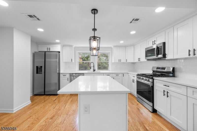 Beautifully renovated 4-bedroom, 3-bath home featuring hardwood floors, abundant natural light, an updated kitchen with new appliances, and a finished basement with a full bath offering flexible living space. Enjoy a spacious backyard, central air, and a functional layout designed for everyday living and entertaining in a convenient Verona location.