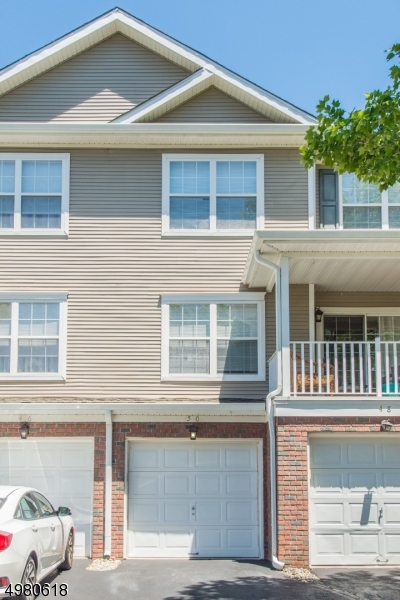 Enjoy a carefree lifestyle w/this spacious 2 bedroom, 3-1/2  bath town home! The main floor offers hardwood floors throughout the foyer & into the family room. The family room includes a large slider offering a beautiful view of the outdoor patio & letting in tons of natural light. A spacious kitchen w/peninsula & dinette offers great space for dining & entertaining. The lower level enters from the attached 1 car garage and includes a den with 3 piece bath. The upper level is where you'll find a large master bedroom with attached bath which includes a soaking tub, separate shower and double sinks.  A second spacious bedroom & another full bath complete the upper level. Easy access to Back Beach Park w/tennis courts, playground & pavilion.Close to town center, shopping, major roadways, bus access.