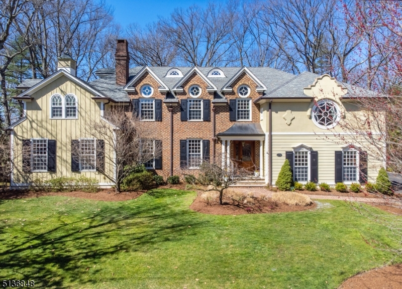 This meticulously cared for 7BD/5.5BA residence home is certain to turn heads with its remarkable style, beautifully landscaped half-acre grounds, elevator accessibility and excellent Short Hills location. Built by architect Thomas Baio, the 6,800SF stunner is filled with cherry floors, substantial wainscoting, crown molding and designer lighting. Perfect for entertaining and comfortable daily life, the main floor includes a grand entry, formal living and dining rooms, powder room, a vaulted family room and masterful culinary kitchen with a breakfast room, command center, storage pantry and butler's pantry. A bedroom suite and another bedroom perfect as a home office complete the level. Above, the palatial owner's retreat dazzles with a sitting room, private deck, en suite spa bath, WIC and access to a laundry room with cedar storage. Another suite with a semi-private bath, two bedrooms that share a Jack-and-Jill bath and a fifth bedroom provide luxurious accommodations, while a regal library and upper-level office provide exceptional work-from-home space. The lower level delivers a sprawling rec room, bath, gym, wine room and closets, while attic provides more storage space. Zoned HVAC, two water heaters, security cameras, 24KW generator, sump pump and integrated sound system. Attached (heated) and detached garages. Breathtaking facade. Outstanding location close to local golf courses, Mall at Short Hills, South Mountain Reservation, highways and train stations.