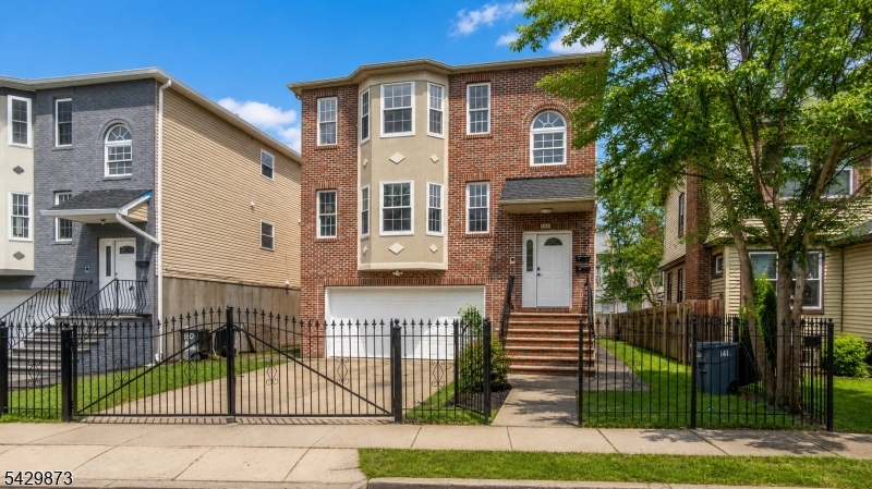Exceptional two-family home spread across 3 spacious levels, offering a rare opportunity for both investors and owner-occupants. Immediate occupancy available with flexible layouts and abundant space throughout.Unit 1 features a massive duplex-style layout spanning 2 floors with 5 huge bedrooms, 3 full bathrooms, and an oversized recreation room perfect for entertaining, a media room, home office, gym, or additional living space.Unit 2 offers convenient single-floor living with 3 spacious bedrooms and 2 full bathrooms.Additional highlights include a fenced-in backyard, detached 2-car garage, and separate expansive living areas designed for comfort and functionality. Conveniently located near the East Orange Train Station for an easy NYC commute, as well as close proximity to shopping, schools, parks, and major highways.Immediate occupancy available. A rare multi-family opportunity with endless possibilities.