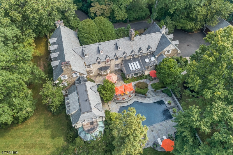 "The Bristol Estate" Magnificent Stone and Shingle 10,000 sq ft estate is  ideally located on park like 4.72 acres in prestigious location in Westfield! This breathtaking home has everything you ever dreamed of! Renovated to perfection...fabulous for entertaining...A huge gourmet eat in kitchen, grand dining room, state of the art media room, luxurious master bedroom suite with fireplace, sitting room and gorgeous new Spa-like Master Bath, formal library & guest suite, with grounds that feature extensive stone walls, multi-level slate patios, new tennis court (2010), heated in-ground pool, separate in-ground spa, 5 car garage - attached 3-bay & detached 2 bay garages.