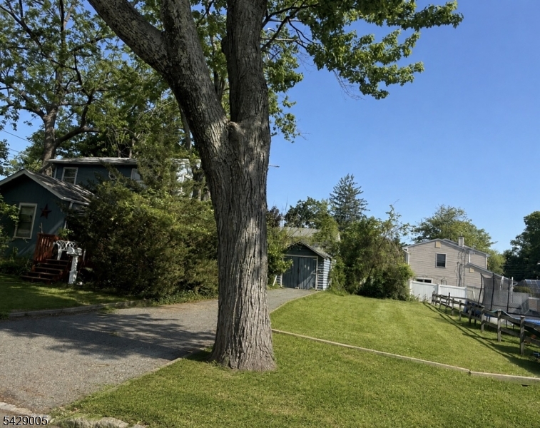 Investor special,  Attention builders and contractors, this is the project you've been waiting for, value is in the land. Rare 80 x 100 large flat lot in an exceptional location. Cash buyers only. Property being sold strictly AS IS. An in ground UST tank has been removed.. Ideal opportunity for builders, or investors looking to renovate or rebuild. Not located in a flood zone. Walk to town center, shopping, restaurants, and transportation. Excellent potential in a highly desirable area. Full rehab or tear down. Situated on an oversized lot, this property is ready for transformation. Current structure features 5 bedrooms, 2 Full Baths living room, dining room and kitchen, but requires a total gut renovation or re development. NO FLOOD ZONE