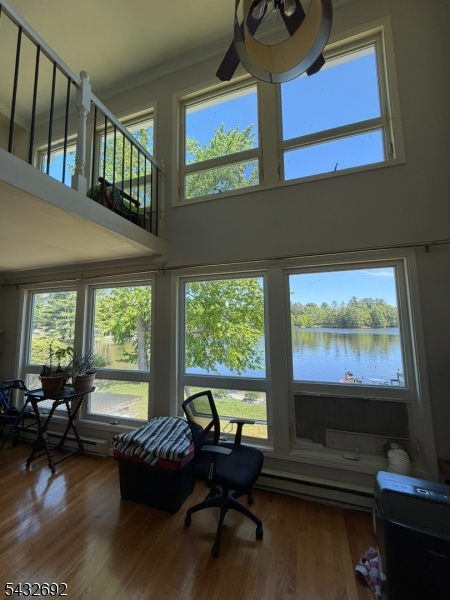 Beautiful full three-level townhouse for sale in the highly desirable High Point Golf Course community, featuring direct lake views and private lake access. This spacious and elegant home offers an open-concept main level with soaring ceilings, oversized windows, updated floors, and breathtaking panoramic water views filled with natural light. Perfect for lake lovers seeking million-dollar views and buyers who appreciate elegant European-quality updates and craftsmanship.The updated kitchen features granite countertops, custom cabinetry, designer lighting, and quality finishes, flowing seamlessly into the living area with a stunning custom stone fireplace wall and European-inspired design throughout.Upstairs offers two spacious bedrooms and a full bathroom. The fully finished walk-out lower level includes a large master suite or guest retreat with a full bathroom, laundry area, and direct access to the lake and outdoor living space.Enjoy the large porch overlooking the water, perfect for relaxing or entertaining. Additional updates include newer windows, updated electrical, and a roof only two years old.Residents enjoy lake privileges, a community pool, dog park, and the peaceful atmosphere of this sought-after golf course community. Recognized by community members as one of the most stylish, spacious, and beautiful condos in the development, this exceptional waterfront property offers elegance, comfort, and resort-style living year-round.