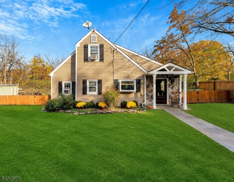**Multiple offers Received** Please submit your offer by Friday 5PM**Adorable cottage-like Cape Cod set on an extremely private lot just under an acre in Lebanon Borough! This charming 3 bedroom, 2 full bath home offers an inviting open floor plan, a cozy living area & thoughtful updates throughout. The newly updated kitchen features stainless steel appliances & flows easily into the main living space, creating a warm & functional layout for everyday living & entertaining. The first floor includes two comfortable bedrooms, a full bath, a wood-burning stove, and sliding doors that open to a brand-new rear deck overlooking the beautiful backyard. Upstairs, the private primary suite features an updated full bath, office and access to a second-story balcony with a stunning view of the home's peaceful, park-like setting and steps down to the yard. A truly unique home! There is also a half bath with sink and room for a toilet off one of the main floor bedrooms maximizing the the use of the public sewar system!  One of the home's greatest highlights is the incredible backyard   fully fenced, flat, open & enhanced by fresh landscaping, mature trees, and the new spacious deck. Bilco basement door. The chickens in residence are productive & also come with the sale of this amazing home! Public sewer, public water & easy proximity to Routes 22, 78, & 287 make this an incredibly convenient place to call home. Clinton Township middles school & blue ribbon North Hunterdon HS