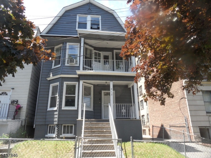 Unique Multi Family With 8 Garages And 4 Parking Spaces On Lot, Great For Investments Or Owner Occupied