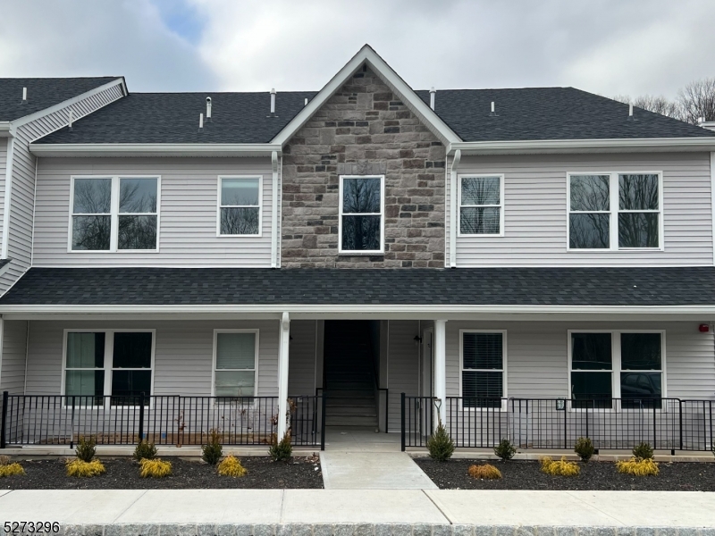 Newer townhouse complex, Mountain Way in one of Parsippany's most sought out neighborhoods!  Second floor interior unit with outside deck and stairs to back yard lawn area.  Enjoy this open concept style of living with a Living Room, Dining Area, and Kitchen/Dining Area.  A foyer leads to a Coat Closet, Linen Closet and Washer and Dryer.  Bright and airy with neutral colors.  Hardwood floors and wall-to-wall carpeting in both bedrooms.  Enjoy one full bath and plenty of cabinet space in the Kitchen.  This ideal location, while nestled in the mountain landscape of Morris County is also a commuter's dream - close to various NJ transit buses and trains, and all major highways, including Route 287, Route 46 and Route 10 - you are only 30 miles away from NYC!