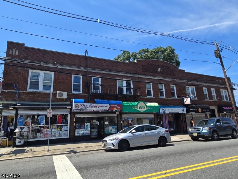Exceptional Turnkey 12-Unit Mixed-Use Investment Opportunity! 835-839 Sanford Ave. Meticulously maintained and proudly owned by the same family for over 40 years, this all-brick mixed-use building has been thoughtfully renovated and impeccably cared for. The property features 6 commercial storefronts and 6 residential apartments, with long-term tenants and established businesses creating a strong, diversified income stream in a prime location near the Maplewood border. Current gross income is strong, with excellent upside through rent optimization. All tenants, including the owner's unit, are on month-to-month leases, providing flexibility for investors. Additional income OPPORTUNITIES include 7 fenced rentable parking spaces, coin-operated laundry, and individual tenant storage units. The property also offers a high-ceiling, semi-finished walkout basement with front and rear access, ideal for storage or additional utility space. Capital improvements include a roof with a 5-year warranty, newer windows, new steel lintels, professionally sealed exterior brick, and sealed basement walls. The fully fenced rear yard features gated access from Sanford Place. A rare opportunity to acquire an exceptionally maintained mixed-use asset offering stable cash flow, value-add potential, and long-term appreciation in one of the area's most desirable investment corridors.