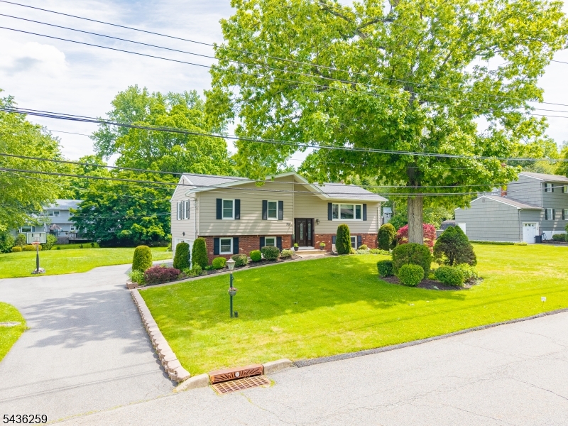 Beautifully updated and move-in ready, this spacious 4-bedroom, 2.5-bath bi-level offers the perfect combination of comfort, style, and functionality. From the moment you arrive, you'll appreciate the care and attention that has gone into the many improvements throughout the home, including updated roof, driveway, windows, bathrooms, kitchen, septic and more.The heart of the home is the stunning updated kitchen featuring granite countertops, a center island, and an open-concept layout flowing seamlessly into the living room and dining room perfect for entertaining and everyday living. Hardwood floors throughout the first level add warmth and timeless appeal, while fresh paint and tasteful updates create a clean, welcoming atmosphere ready for its next owner to simply unpack and enjoy. The lower-level family room offers a cozy wood-burning fireplace, creating the perfect space to relax and gather during cooler months. Outside entrance walkout access leads directly to the patio and backyard, making indoor-outdoor living effortless.Step outside to your own private backyard retreat complete with a deck, patio, heated above-ground pool, storage shed, and an expansive level half-acre property offering endless possibilities for recreation, gatherings, gardening, or play. Whether hosting summer barbecues, enjoying pool days, or simply relaxing outdoors, this property was designed to be enjoyed both inside and out.