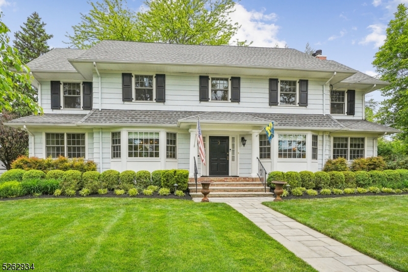 Nestled in the coveted northside Gardens neighborhood, this sophisticated center hall Colonial spans 5000 square feet and boasts 6 bedrooms, 4 full and 2 half baths. Originally built in 1923 and renovated in 2006, it exudes impeccable craftsmanship. The first floor features a spacious entrance hall, gracious living room with coffered ceiling and gas fireplace, elegant formal dining room and sun-filled den/office. The chef's kitchen with top-of-the-line appliances including two dishwashers, island, pantry, and breakfast area, flows into a large family room with wood-burning fireplace and wet bar. The first floor also offers a butler's pantry, laundry/craft room with outdoor access, and powder room. The primary ensuite features a bath with double vanity, steam shower and custom walk-in closet. The basement houses a recreation room, gym, half bath, and plentiful storage. Living space extends outdoors with a covered porch, bluestone patio, and a secluded "Zen den" patio. Home amenities/features include a home automation system, sprinkler system, 2 zone heat/AC, updated windows, and a whole house generator. Convenient location to award-winning downtown, schools, NYC transport, highways, and airports.