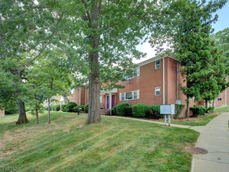 This is not your typical Mountain Club condo! Why pay rent when you can buy this brand-new, beautifully renovated, 1st floor, 1 bedroom + den in a prime, location right by the pool and club house! New flooring. Spacious living room with tons of light. New kitchen with higher-end cabinets, quartz countertops & newer appliances. Dining room was converted to a den / office with extra closet. Freshly painted throughout. Bedroom has 2 large closets. Living room picture window is being replaced--paid for, on order and will be installed in August. Heat is included in your low monthly maintenance fee along with water, sewer, trash & more! Parking spot conveniently located directly behind unit; garage is not deeded, yet available for $40 extra per month. Secured storage unit along with coin-operated laundry facilities located in building. Amenities include pool, sauna, gym, tennis courts and use of newly renovated exercise room in club house. Super close to trains, major highways and shopping!