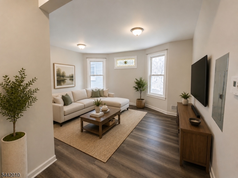 Renovated first-floor 3-bedroom, 1-bath apartment featuring an open-concept kitchen and living area, updated kitchen with stainless steel appliances, modern bathroom, and luxury vinyl flooring throughout.Additional features include backyard access, washer/dryer hookups in the basement, and pet-friendly accommodations. Water and sewer are included; tenants are responsible for all other utilities. Conveniently located within walking distance of a train station with easy access to Newark and NYC.Available immediately.