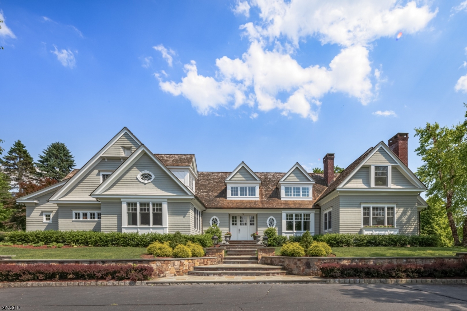 Designed and built by the architectural firm of Brandes Maselli. Rich natural materials, timeless interior design and craftsmanship have created an ambiance of casual elegance & serene enjoyment French doors open to the pergola bedecked bluestone terrace & landscaped grounds w/ pool & spa. Gallery Halls, high ceilings, quarter sawn oak floors & 4 fps. Refined architectural detailing define the understated sophistication of this gracious home. The beautiful gourmet kitchen hosts a large island w/raised breakfast bar and opens to the sun filled great room w/ 16' vaulted bead board ceiling. Wonderfully detailed are the living room, dinning room & Cherry paneled library. 5 en suite BRs. First floor Primary Suite w fitted walk-in closets, steam shower & soaking tub.Fin LL w/ rec rm, exercise rm & full bath.