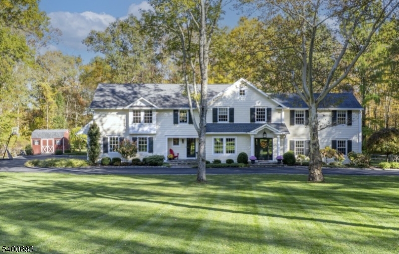 Fully restored 5BR, 5 FB/2HB colonial nestled on 1.5 acres. Designed by the homeowner, an interior designer, this home blends timeless style w/ functionality. Every detail has been carefully considered from the cohesive color palette & custom finishes to the well-planned flow of each space. Light-filled rooms, quality materials, & refined design choices make this home beautiful & livable. Upon entering, you're greeted by a sweeping staircase that sets the tone for the elegance of this home. A sun-filled great room exudes sophistication, w/ tailored built-ins, gas FP & French doors. Formal DR provides a perfect setting for intimate dinners or grand gatherings. Adjacent butler's pantry enhances functionality w/storage, prep, & office nook.The gourmet kitchen is designed for everyday & entertaining w/ large island, 48in range & wet bar w/ beverage fridge. Nearby sitting room w/ FP creates a warm & sophisticated space. First-floor laundry & mudroom boast built-ins & a 2nd staircase for effortless convenience.?2nd fl is a sanctuary of privacy, featuring five spacious bedrooms, each with ensuite bath.?Primary retreat features spa bathroom, walk-in closet & ambiance of serenity. Each bedroom is designed to feel like a personal haven, w/ walk-in closets & luxurious baths. 2nd fl office offers refined workspace. Basement is designed for fun & productivity w/ HB, rec area, gym, & workroom for hobbies. Backyard is a secluded paradise, w/ lush landscaping & multiple areas to gather.