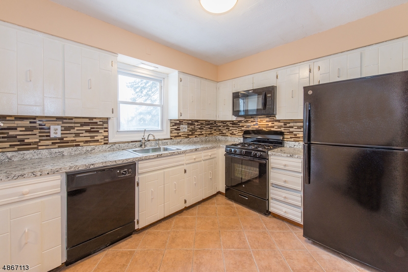 NEWLY RENOVATED in 2018. Spacious Colonial on Quiet Street in Mine Hill. Ideal commuter location. ALL NEW Appliances, Water Heater & Furnace. Open living area, vinyl wood flooring. EiK Kitchen, Large DR/LR w/Glass Sliders & a Cozy FR Anchored by a WB Fireplace for those cold winter nights. 3 Zone Heating?Natural Gas. LOW Cost of Utilities. 2nd floor provides 3 generous sized BDRMs w/4th BDRM on Ground Level Perfect for Guests. 2.5 Baths. New fixtures & finishes. New carpeting. Bright space throughout home, freshly painted &clean. Washer/Dryer Hookup. Oversized 1car garage w/ WiFI Operated Door. Dry space for car, storage or projects. Private, fenced in backyard & HUGE DECK. Wonderful feature for BBQs, entertaining & relaxation time. Ideal location for commuters; easy access to HWYS & trans. direct into NYC.