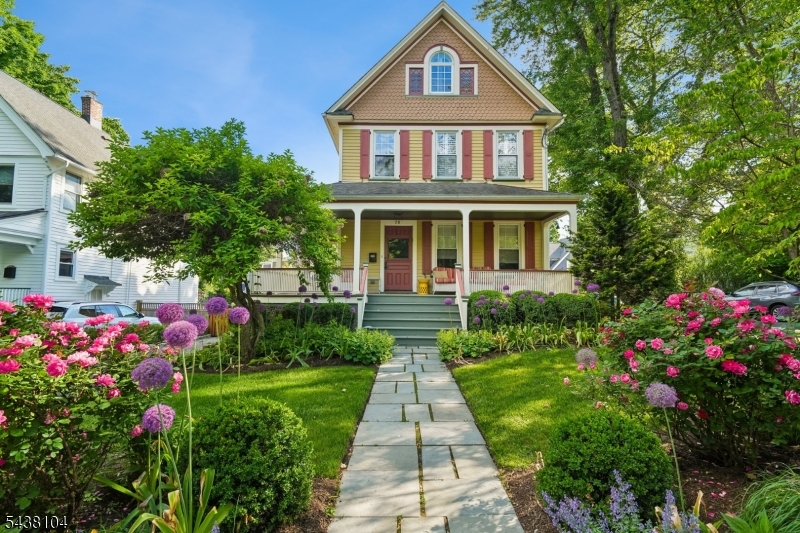Welcome to this Turn-of-the-century Victorian 4 Bed, 2.1 bath, just steps from downtown Maplewood Village & NYC trains. A welcoming wraparound porch sets the tone for this stunning home. Inside, a spacious entry boasts an elegant staircase w/ built-in storage bench & original wood details. Above, light stream through a stained glass feature window. The open formal dining room flows into the living room w/ wood-burning fireplace. Original pocket doors between the rooms add timeless character.  The bright eat-in kitchen is the heart of the home, offering abundant cabinetry, stainless steel appliances, Wolf Pro six-burner gas stove & storage at every turn. French doors open to the private backyard; w/ a separate door to the spacious deck makes entertaining a breeze. Gorgeous wood floors and a circular floor plan create exceptional flow throughout the main level. A powder room completes the first floor.  The second floor offers three spacious bedrooms, a full hall bath, large walk-in linen close & a versatile laundry room/office. Each bedroom features generous closets and built-in storage. Retreat to the third floor dedicated to a private primary suite, complete w/ sitting area, ample storage & a luxurious bath room w/ double vanity & deep soaking tub. The finished basement provides additional living space, thoughtfully designed built-in organization and backyard access. Combining timeless charm & an unbeatable location this special home truly has it all.