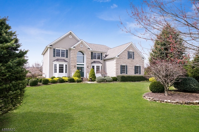 Stately 4 bedroom, 3.1 bath Colonial w/ gleaming hardwood floors & decorative molding throughout. Enter the airy foyer flanked by an elegant dining rm w/ bay window on right, & lovely living rm w/ bay window on left. Gourmet kitchen features center island, granite countertops, tile backsplash, & high-end electric appliances. Eat-in kitchen/breakfast area w/ sliding-glass doors to patio opens to a two-story vaulted family rm w/ wood-burning marble surround fireplace. Ascend the stairs to the majestic second-floor master w/ vaulted ceilings, three walk-in closets, sitting rm, & palatial bath w/ soaking tub & stall shower. Additional bedrooms each w/ spacious closets & large windows complete this floor. Fabulous backyard featuring expansive paver patio, wooden play set, & massive storage shed. Welcome home!